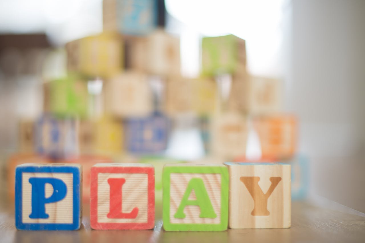 Close-up of colorful wooden blocks spelling PLAY, perfect for educational themes.